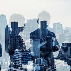 executives silhouettes over city
